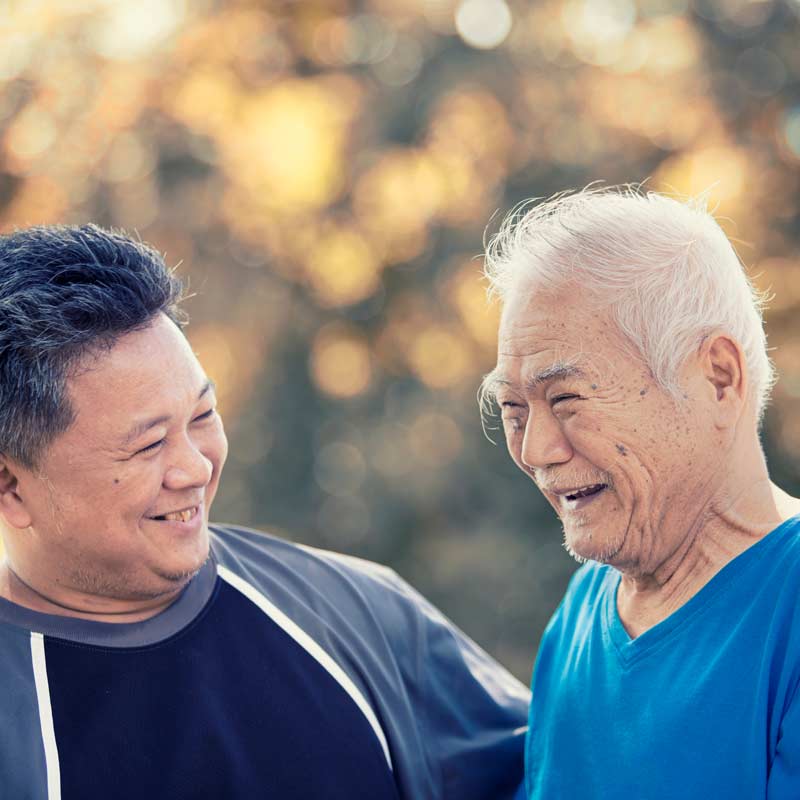 Elder Law Case Management photo of adult son sharing a laugh with his elderly father